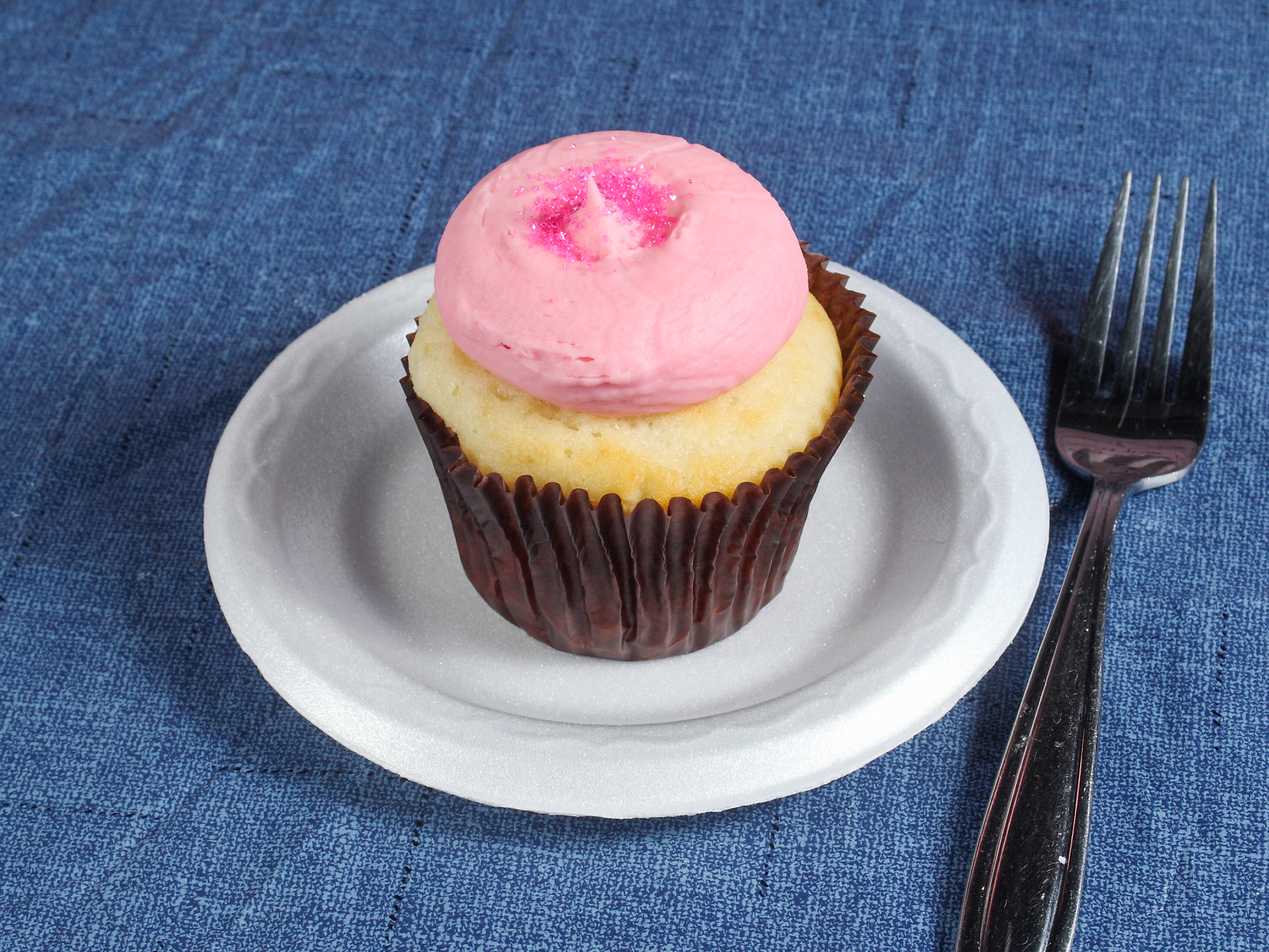 Order Pink Vanilla Cupcake food online from Smallcakes store, Huntersville on bringmethat.com