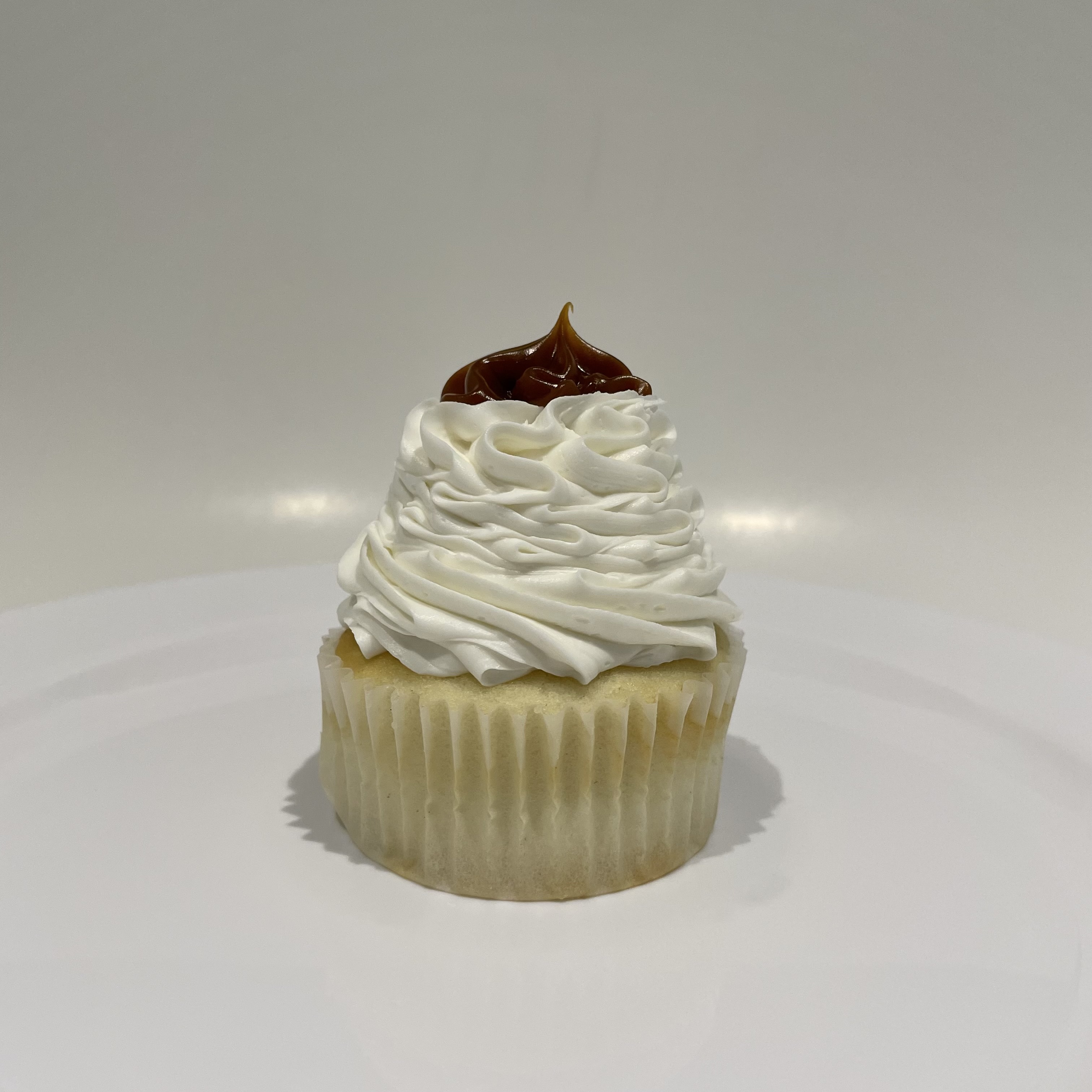 Order Dulce De Leche Cupcake food online from The House of Cupcakes store, Princeton on bringmethat.com