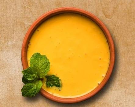 Order Flavored Mango Lassi food online from Curry Consortium store, Irving on bringmethat.com