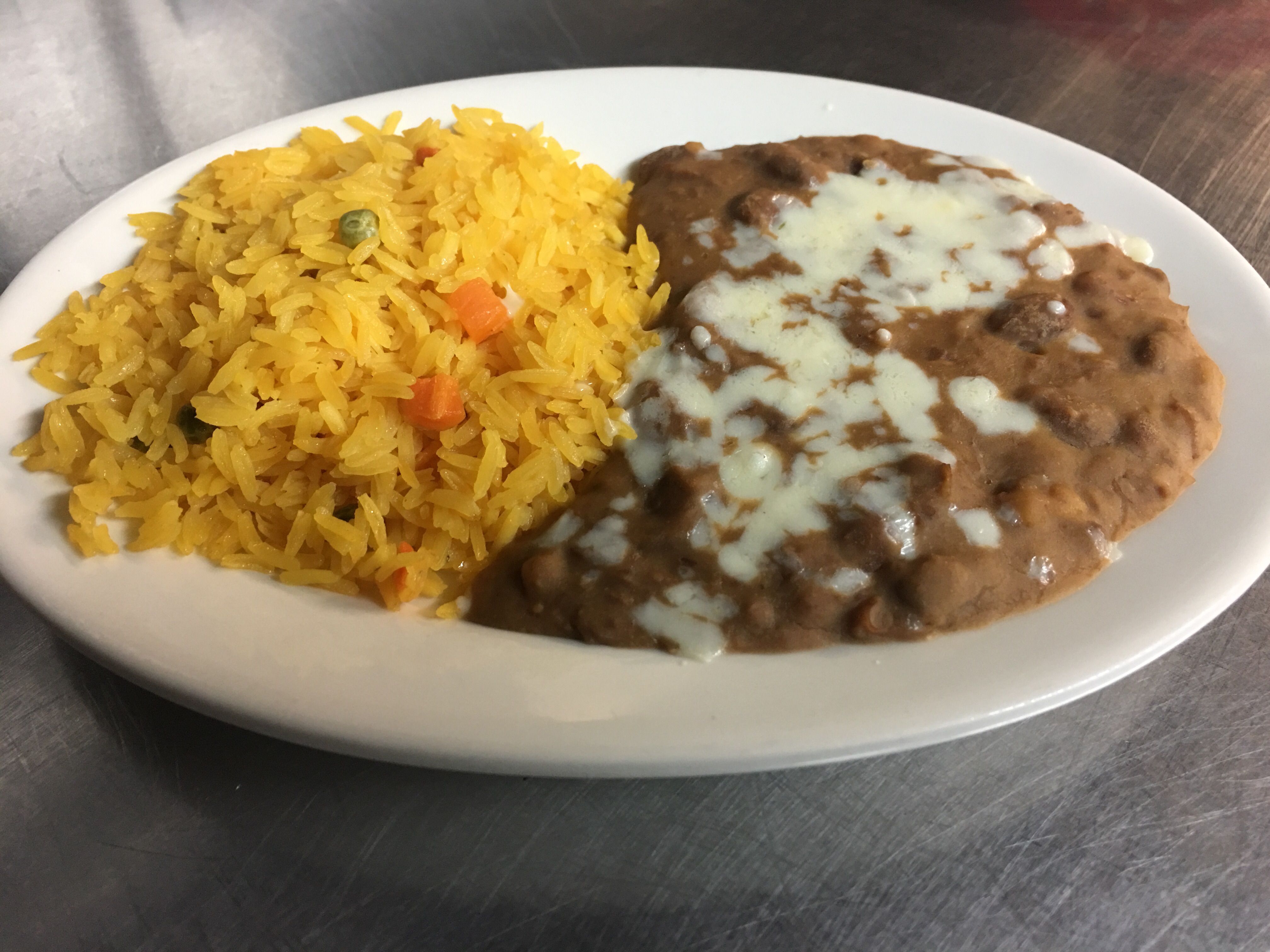 Order Mexican Rice and Refried Beans food online from El Patron Mexican Grill & Cantina store, Albany on bringmethat.com