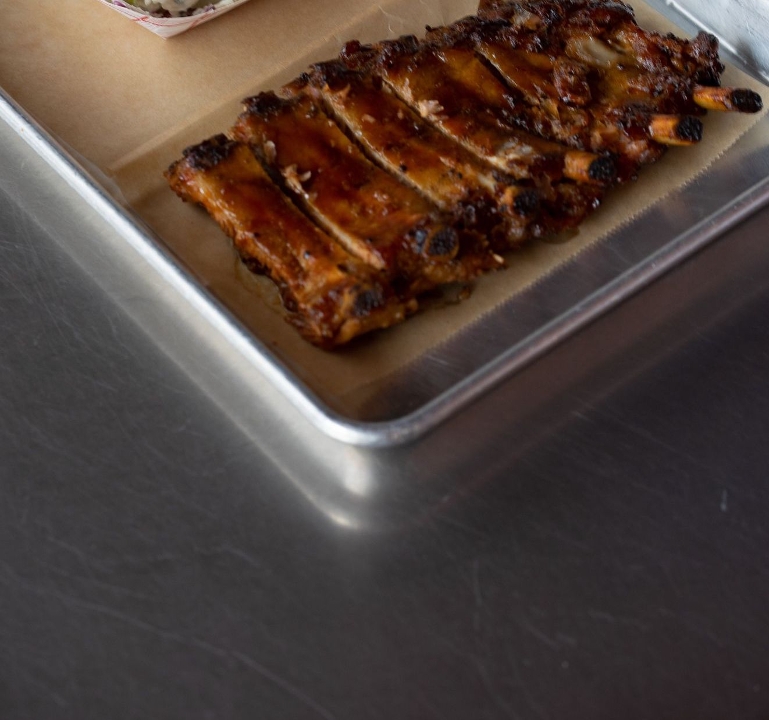 Order Baby back ribs half rack food online from Rocklands Barbeque & Grilling Company store, Arlington on bringmethat.com