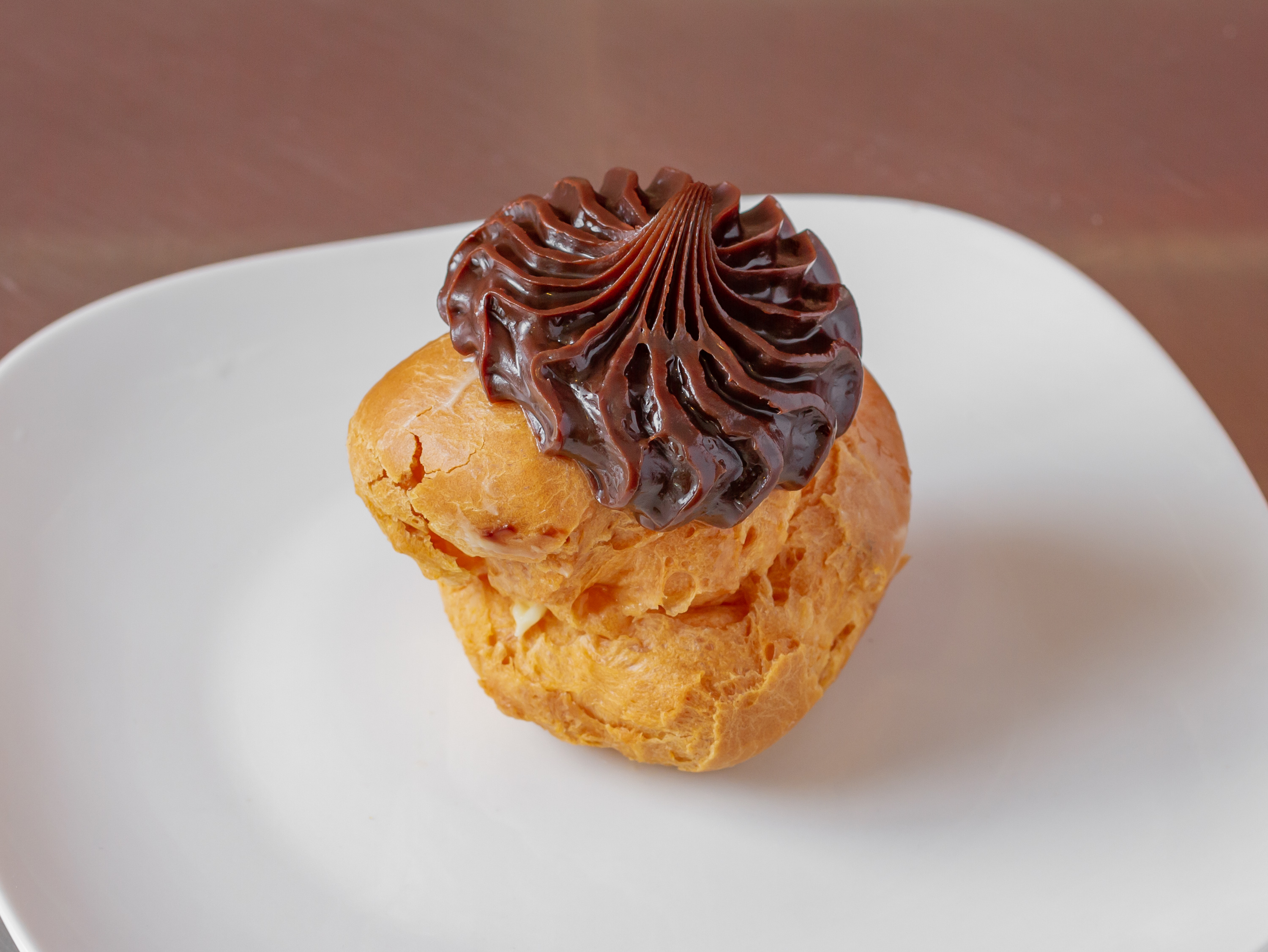 Order Chocolate Cream Puff food online from Vaccaros Italian Pastry Shop store, Cockeysville on bringmethat.com