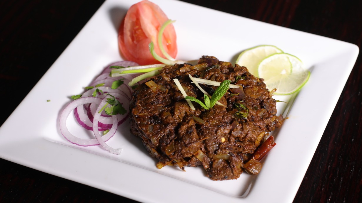 Order Mutton Sukka Varuval food online from Sangam Chettinad Indian Cuisine store, Austin on bringmethat.com