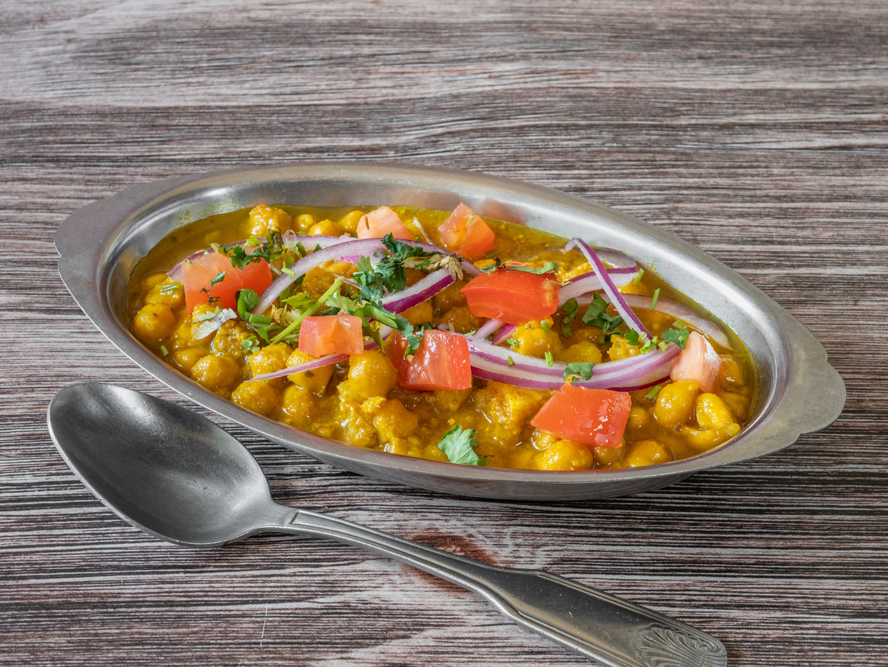 Order Chana Masala food online from Golden Gate Pizza & Indian Cuisine store, San Francisco on bringmethat.com