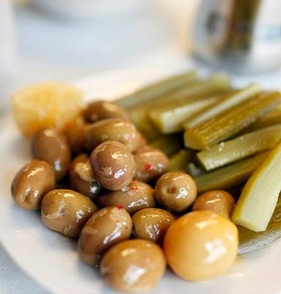 Order Plate of Imported Green Olives and Pickles food online from Aladdin Mediterranean Cuisine store, New Albany on bringmethat.com
