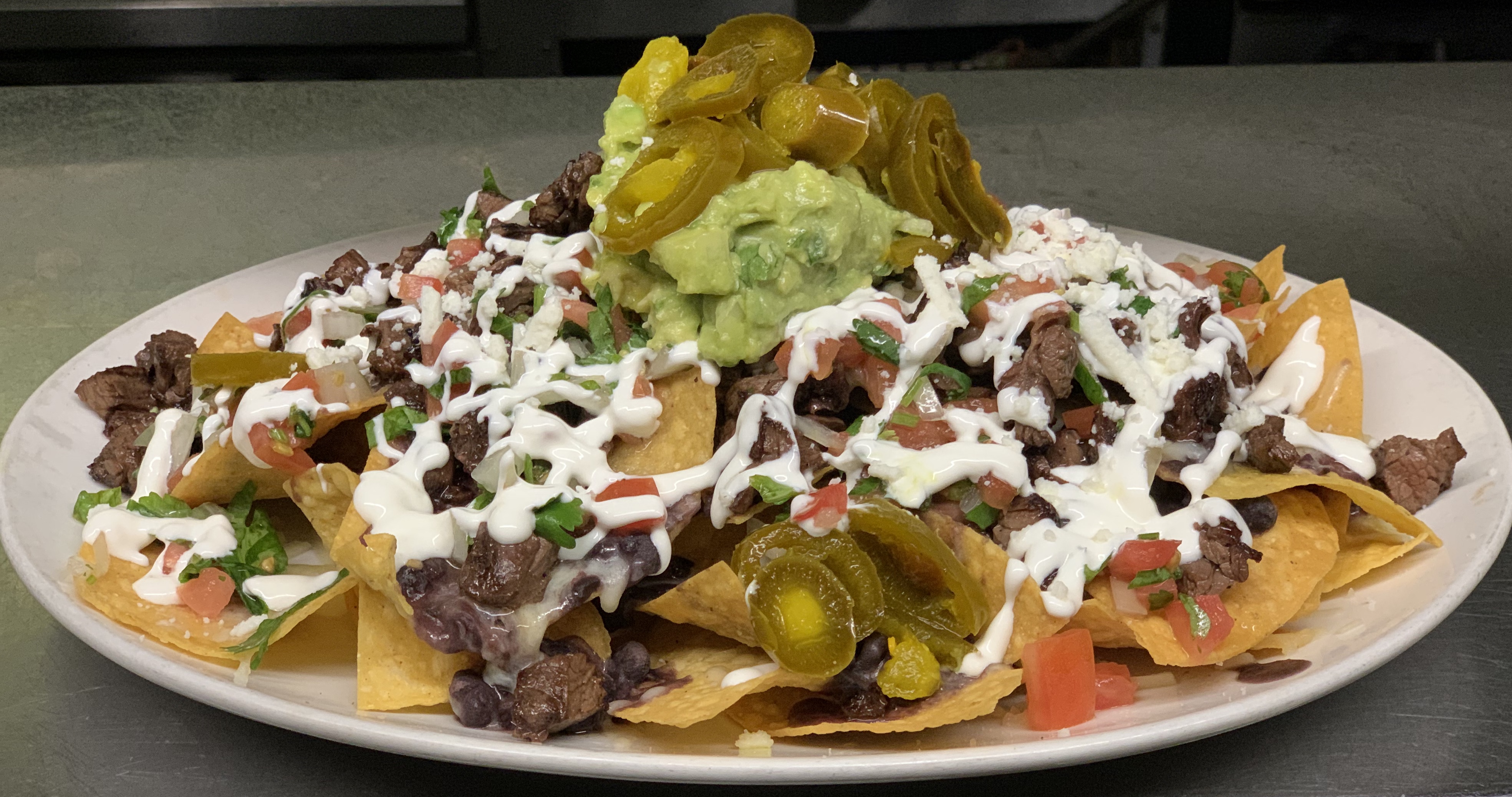 Order Nachos food online from Patron mexican grill store, New York on bringmethat.com