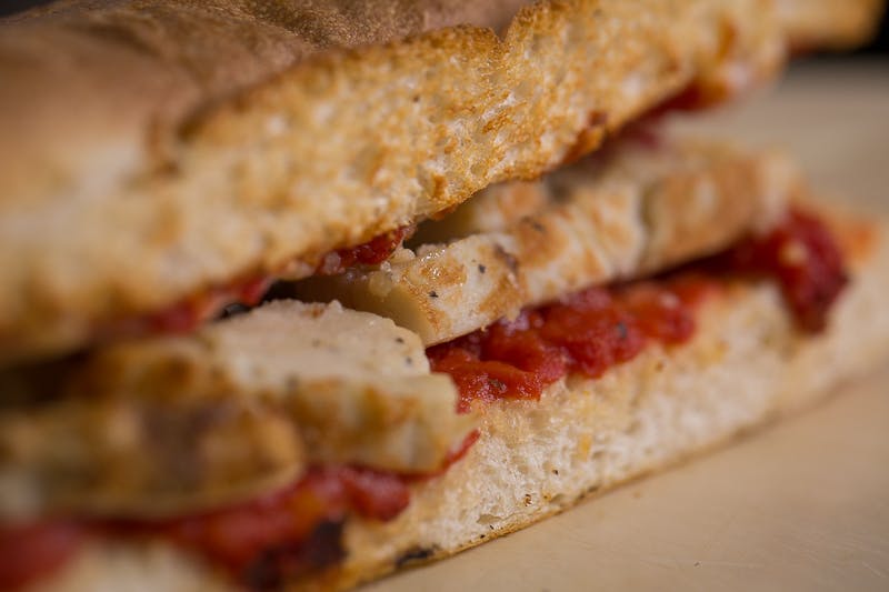 Order Chicken Parmesan Grinder - 8" food online from Mancino Grinders & Pizza store, New Haven on bringmethat.com