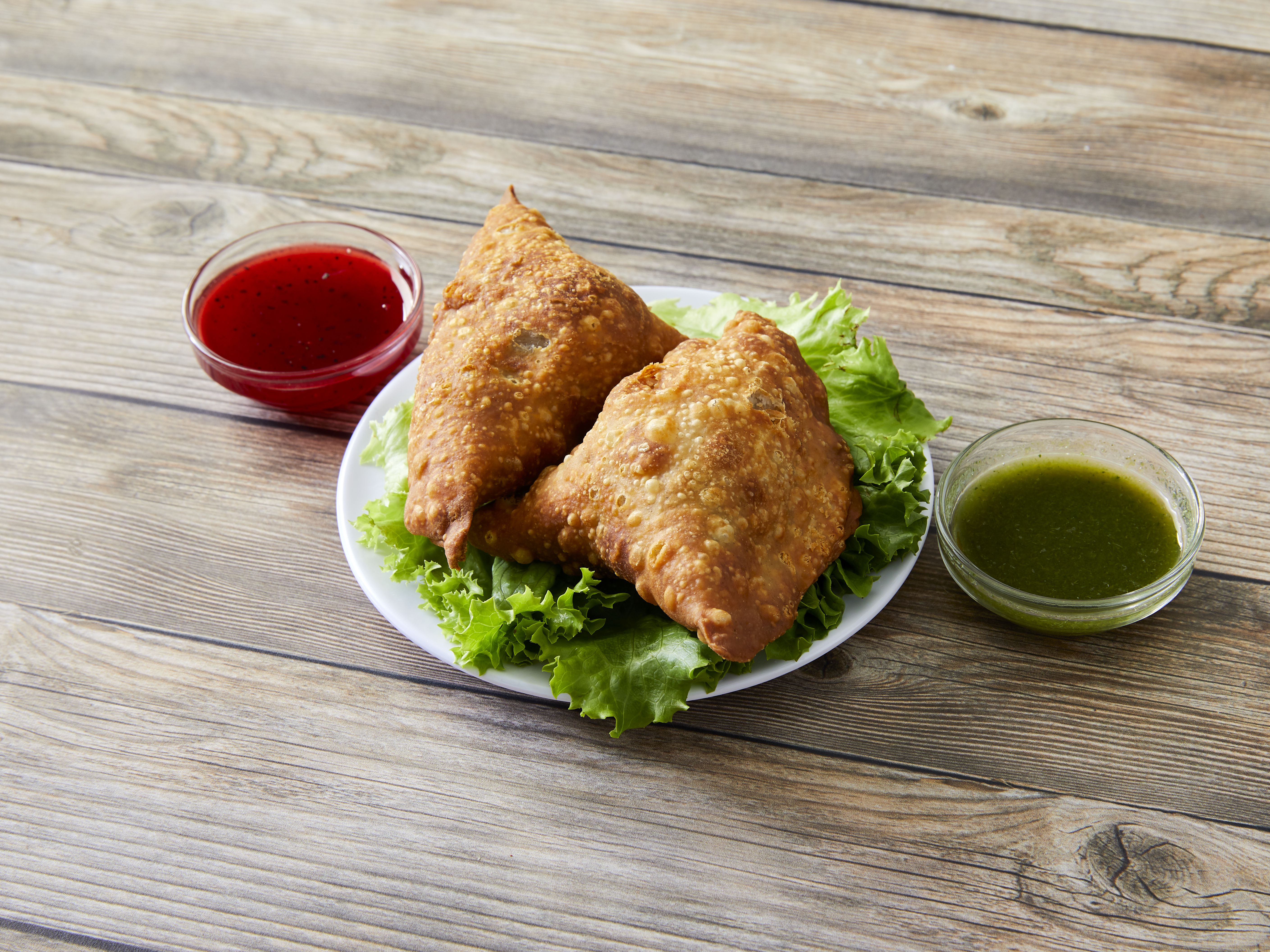 Order 2 Vegetable Samosa food online from Hema's Kitchen store, Chicago on bringmethat.com