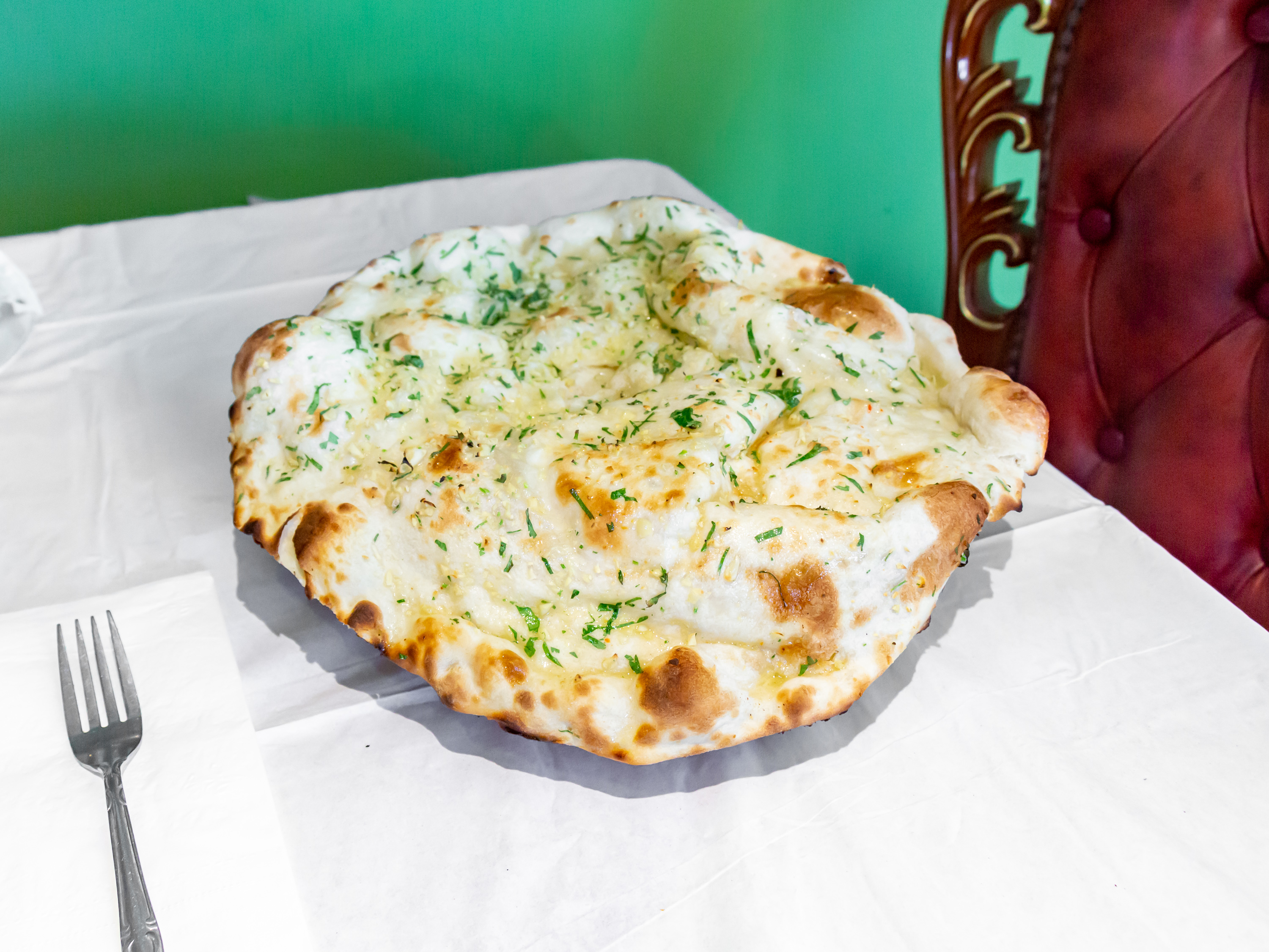Order Garlic Naan food online from Indian Delight store, Catonsville on bringmethat.com