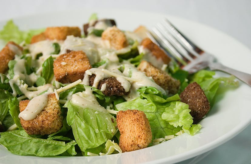 Order Caesar Salad - Large food online from NYPD Pizza store, Orlando on bringmethat.com
