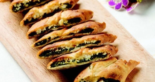 Order Spinach and Cheese Pide food online from Magic Bites Bakery store, Arlington on bringmethat.com