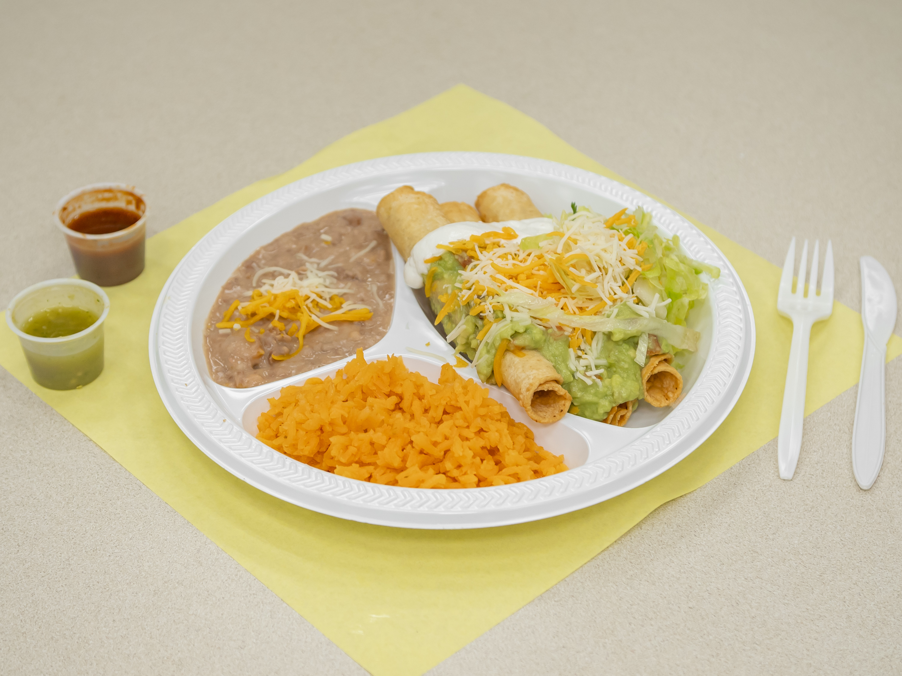 Order 12. Three Piece Rolled Taquitos Combination Plate food online from Lambertos Mexican Rest store, La Verne on bringmethat.com