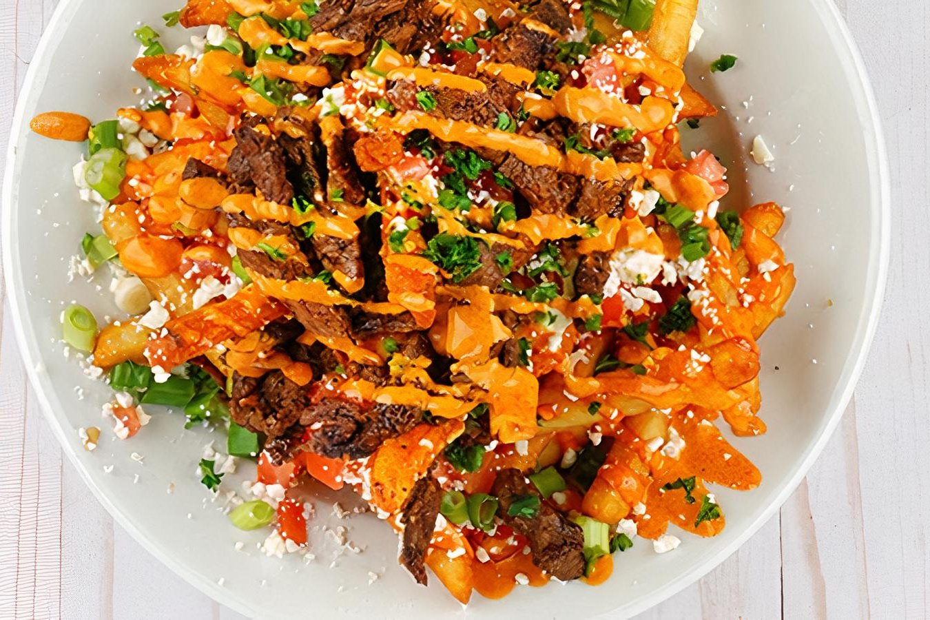 Order Spicy Tri-tip Shawarma Feta Fries food online from Tarme Mediterranean Grill store, Glendale on bringmethat.com