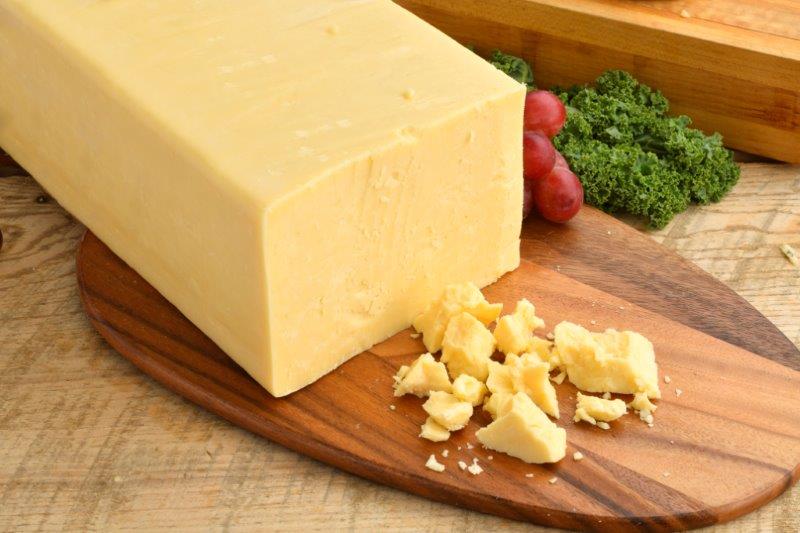 Order Sharp White Cheddar Cheese 1/2 lb. food online from Trunnell Gourmet Deli On 54 store, Owensboro on bringmethat.com