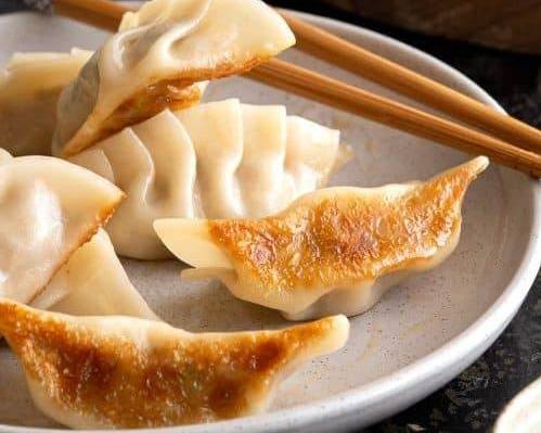 Order Dumplings (10pcs) food online from Danny's Carry Out store, Oxon Hill on bringmethat.com