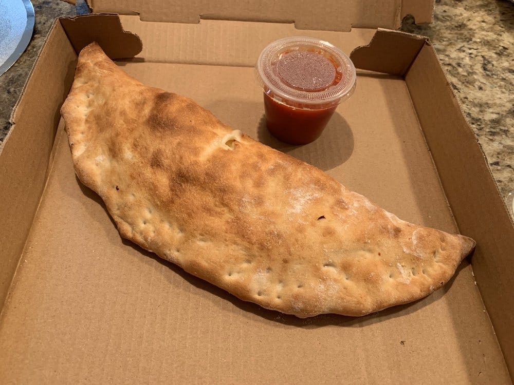Order Calzone - Calzone food online from Little Charlie Pizza store, Williamsburg on bringmethat.com