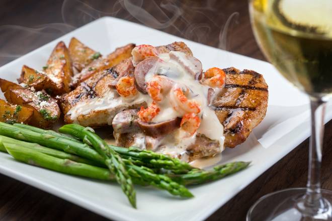 Order Bayou Pork Ribeye food online from The Rouxpour store, Friendswood on bringmethat.com