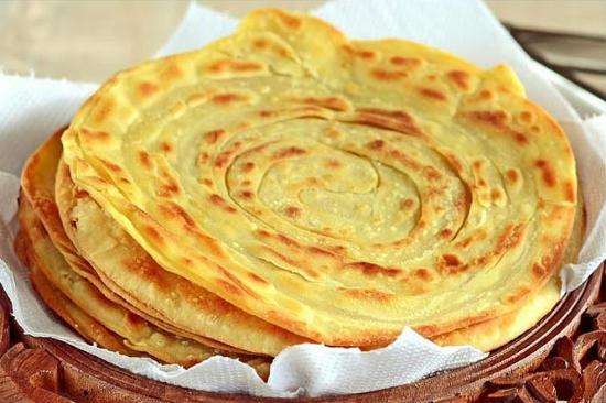 Order Lachha Paratha food online from Shimla Peppers store, Naperville on bringmethat.com