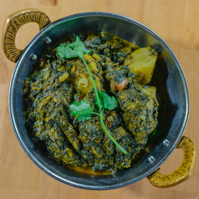 Order Saag Aloo food online from Annapurna Cafe store, Seattle on bringmethat.com