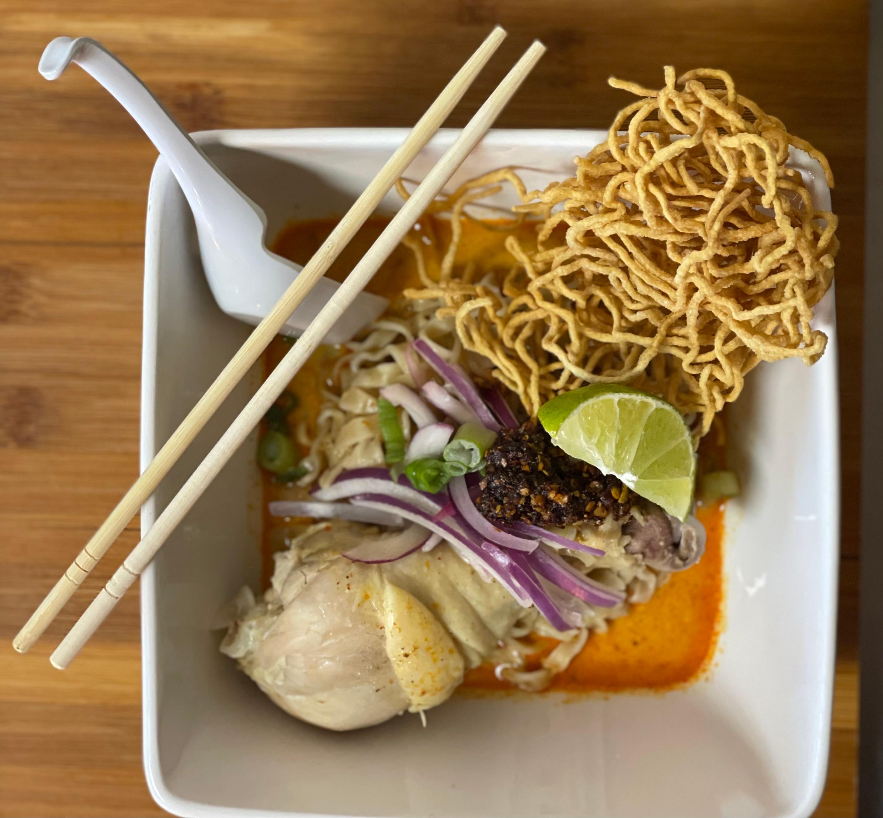 Order Khaw Soi food online from Hidden Garden Thai Cuisine store, Culver City on bringmethat.com