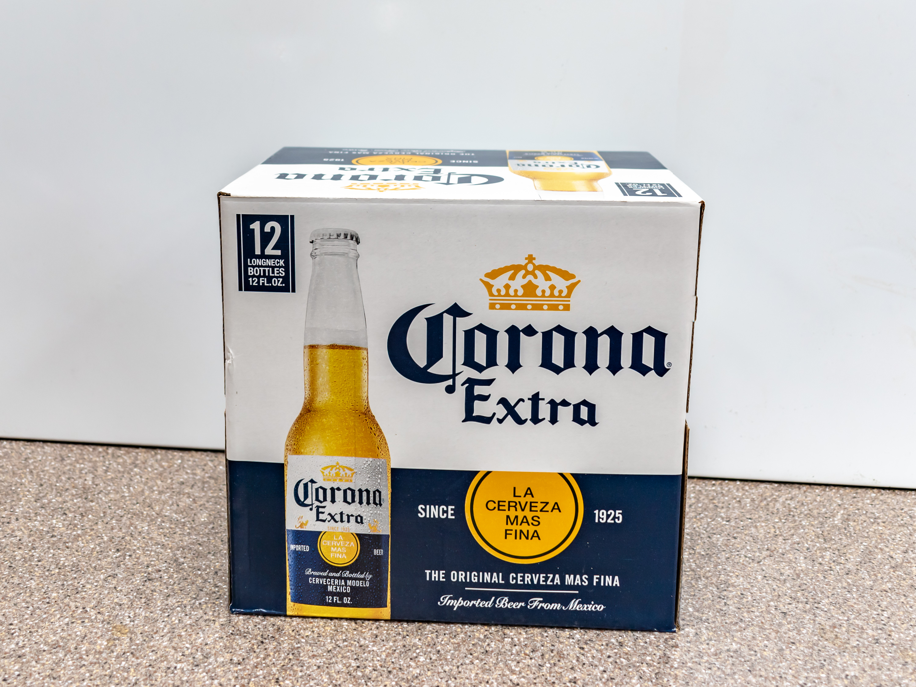 Order Corona Extra Beer, 12 oz. Bottle - 12 Pack food online from Kangaroo Food Mart store, Cathedral City on bringmethat.com
