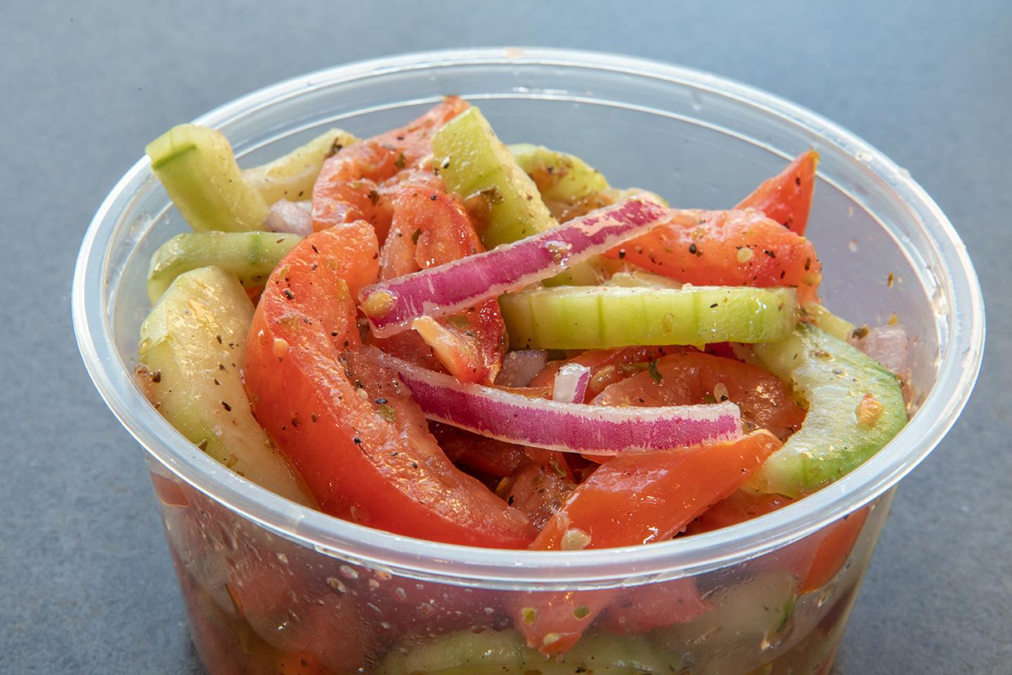 Order Cucumber, Tomato & Red Onion Salad food online from Sticks Kebob Shop store, Charlottesville on bringmethat.com