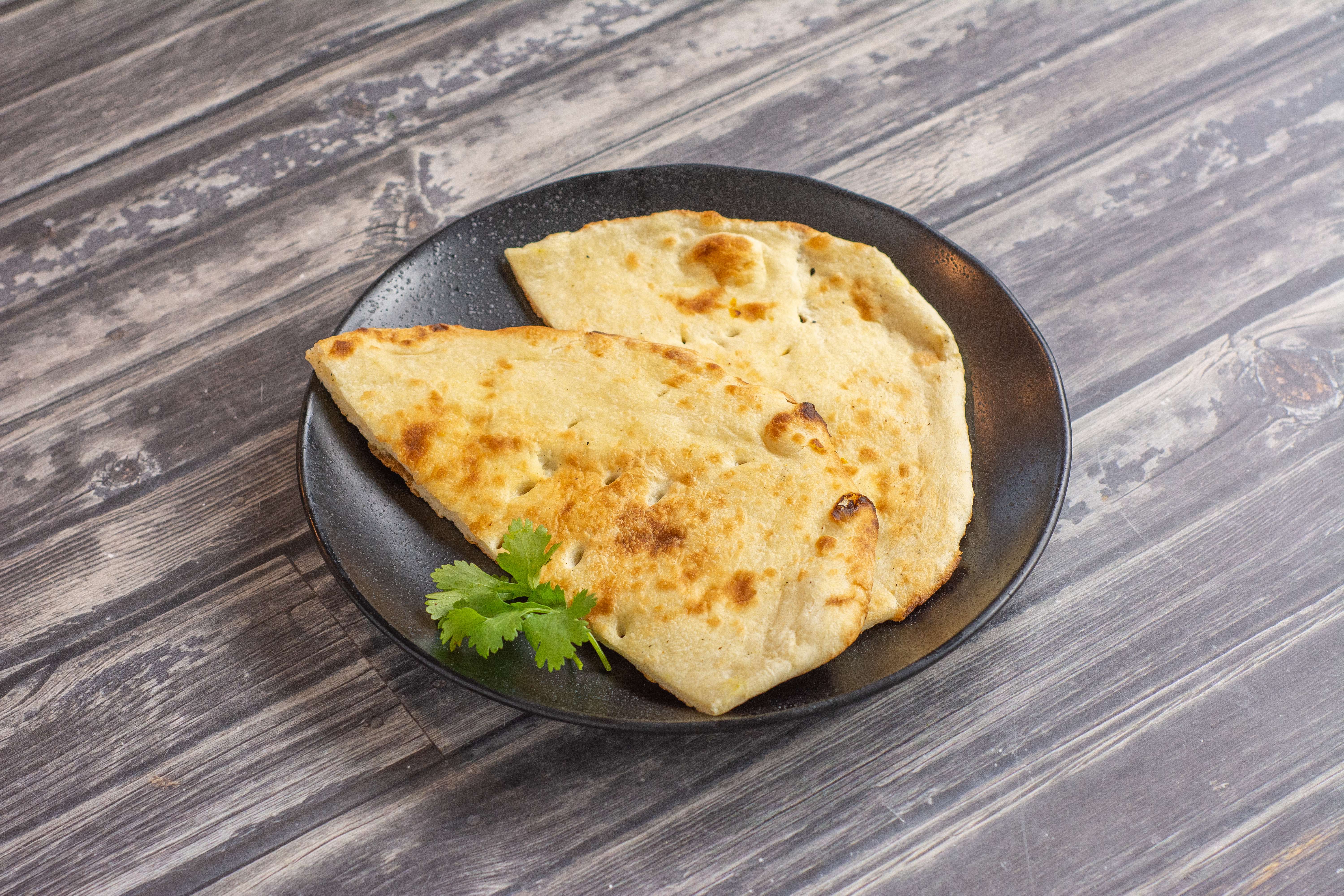 Order Plain Butter Naan food online from Swaad Indian Cuisine store, San Jose on bringmethat.com