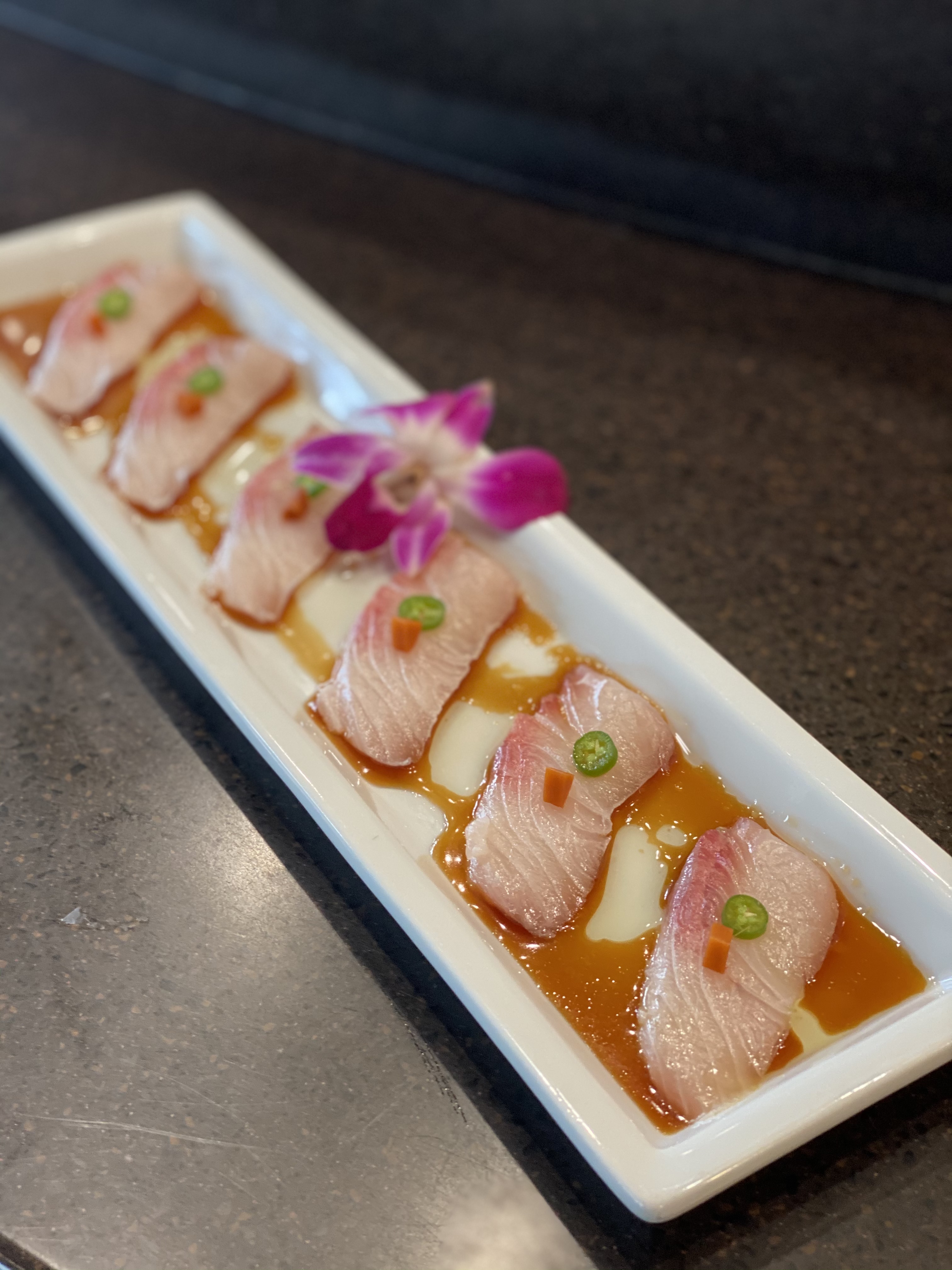 Order Kanpachi Sashimi with Jalapeno food online from Kanpai Japanese Sushi Bar &amp; Gril store, Santa Monica on bringmethat.com