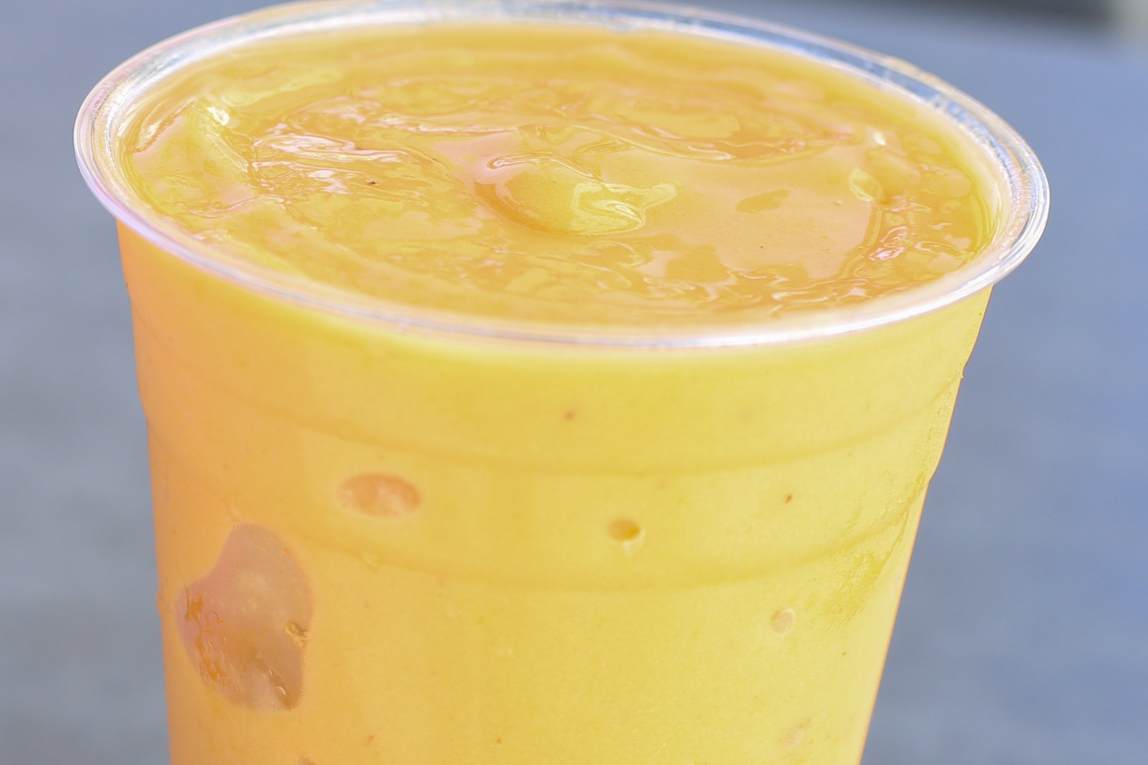 Order Mango Madness-Smoothie* food online from Swami Cafe store, San Diego on bringmethat.com