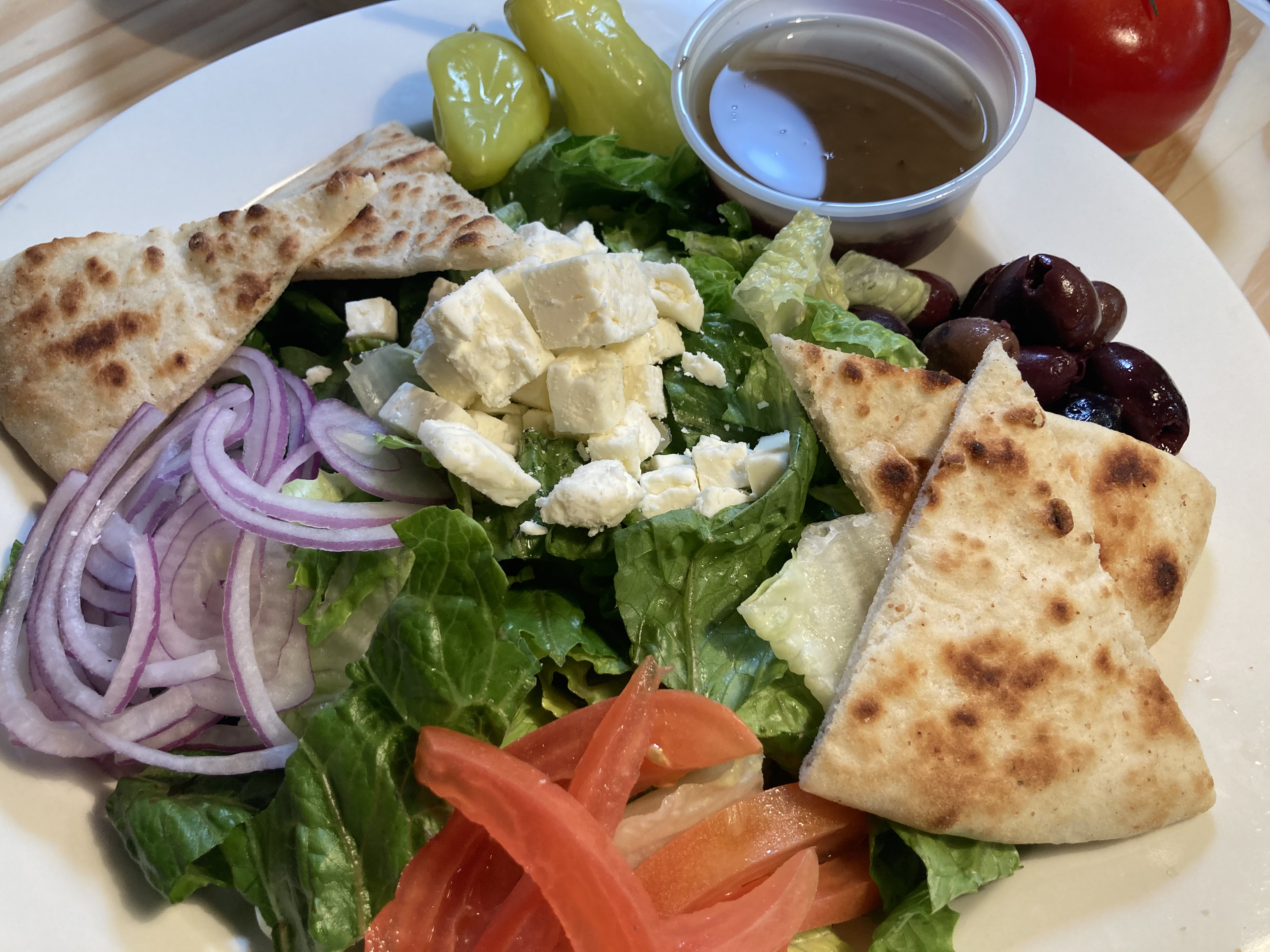 Order Greek Salad food online from Pizza Stop store, Silver Spring on bringmethat.com