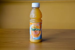 Order Orange Juice - 10oz food online from Daylight Donuts Op store, Overland Park on bringmethat.com