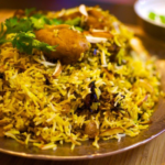 Order 61. Chicken Dum Biryani food online from Taj Restaurant store, Warren on bringmethat.com