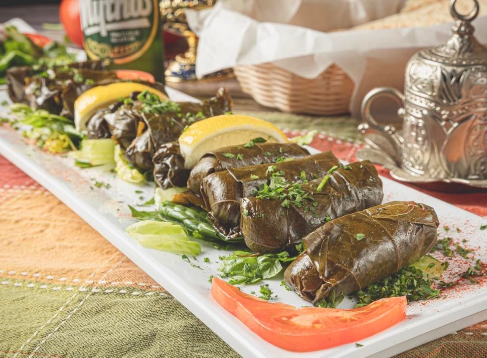 Order Dolmas Plate L food online from Byblos Express store, Highlands Ranch on bringmethat.com