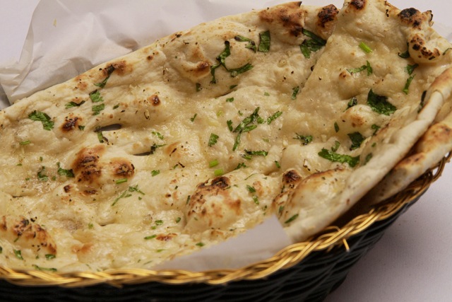 Order Garlic Naan food online from Mount Everest Restaurant - Belair Rd. store, Baltimore on bringmethat.com