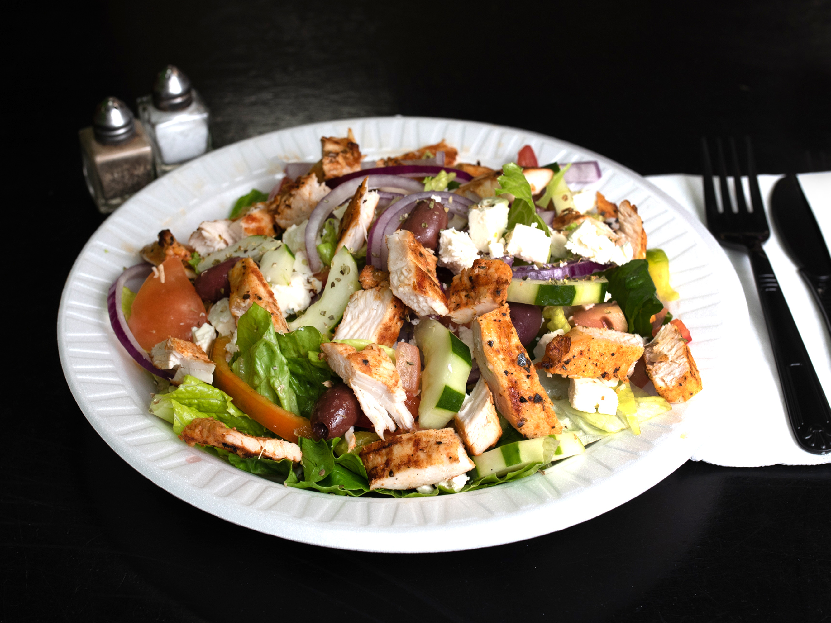 Order Greek Salad food online from Taste Cafe & Grill store, Ozone Park on bringmethat.com