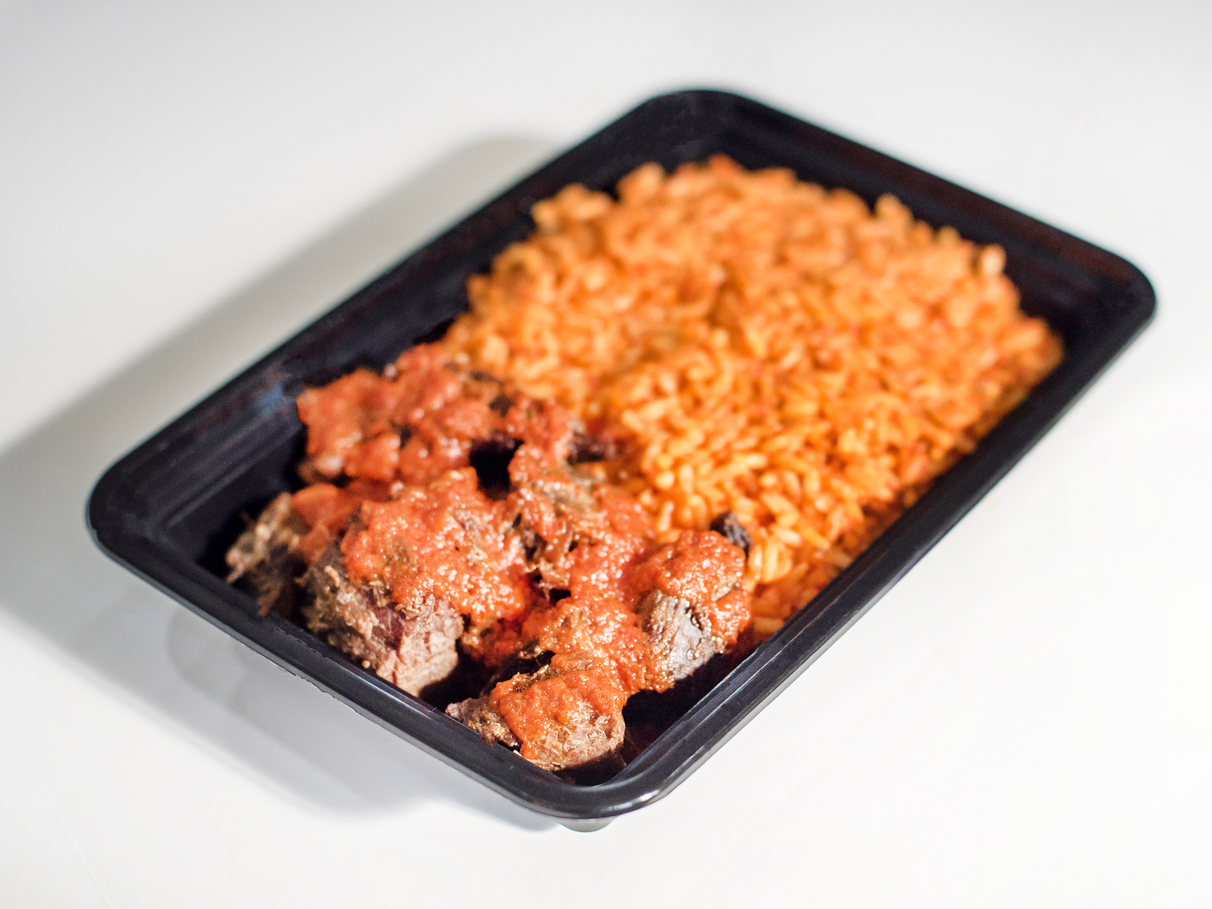 Order Beef and Jollof Rice food online from African Caribbean Food Market store, Oakland on bringmethat.com