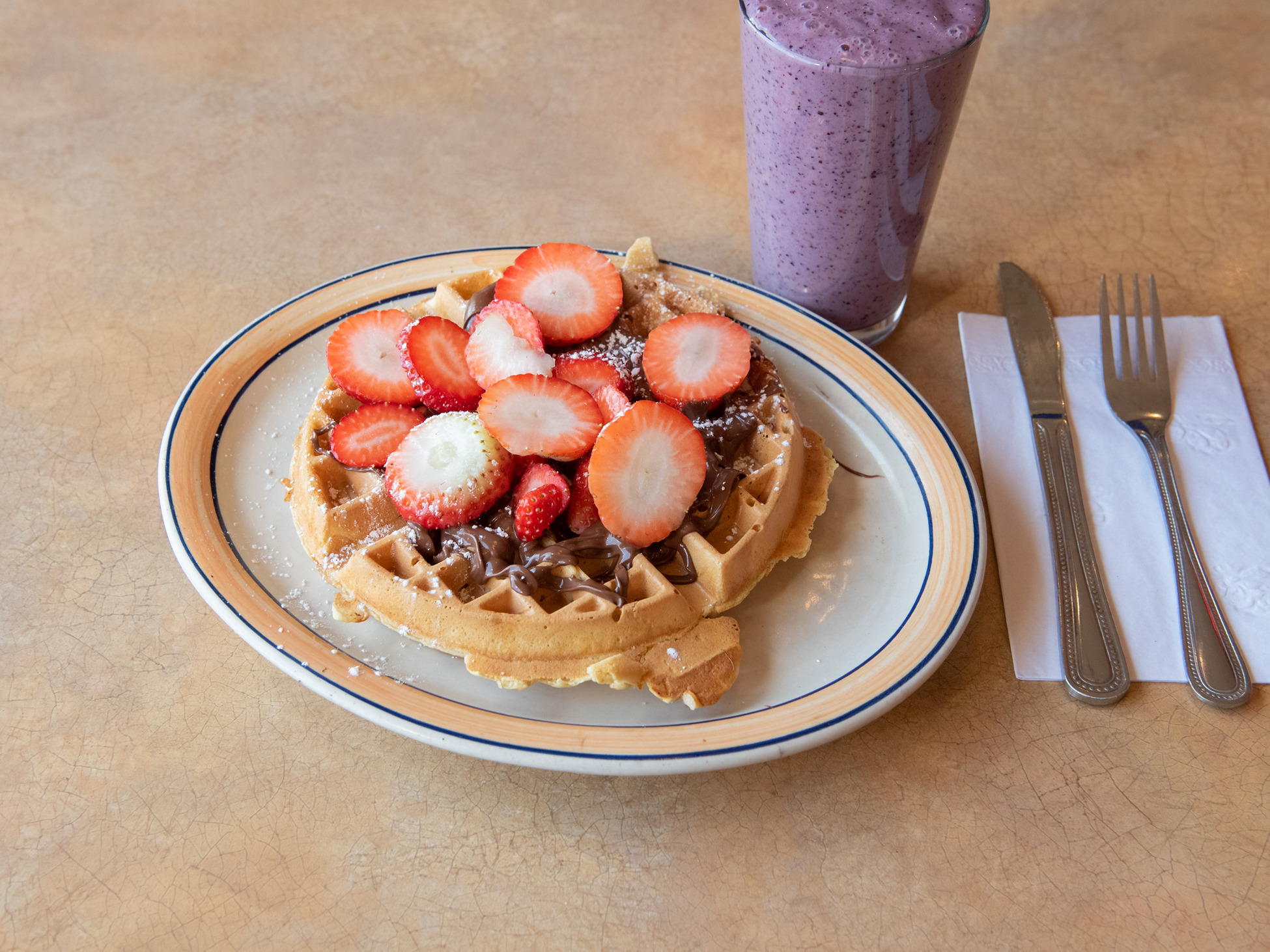 Order Belgian Waffle with Nutella and Fresh Strawberries food online from Acropolis Diner store, Hamden on bringmethat.com