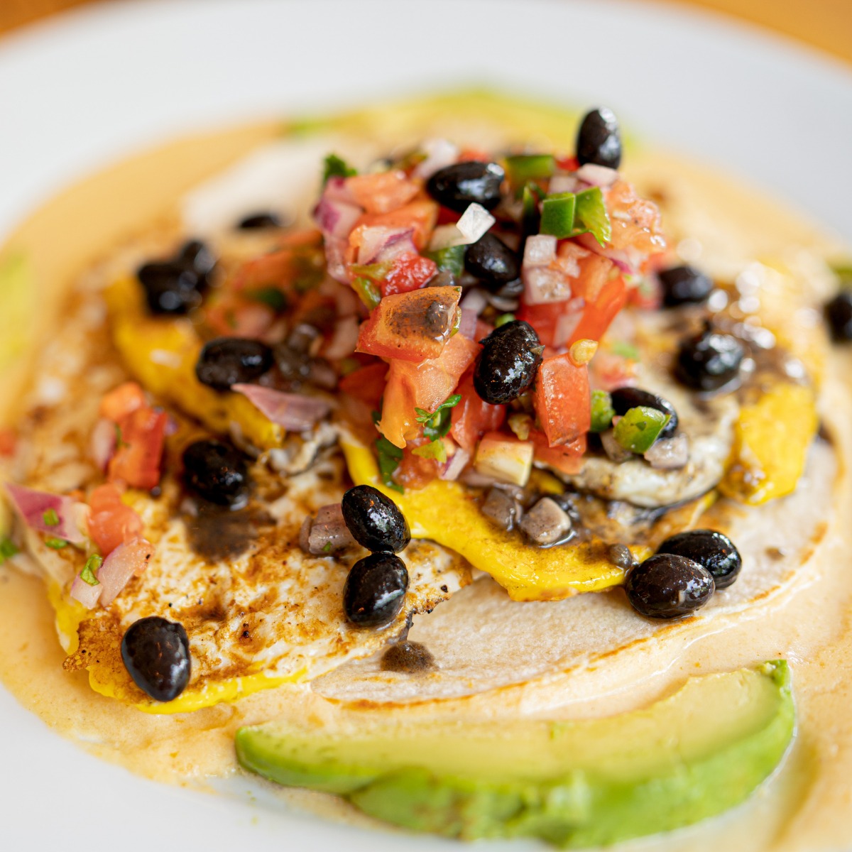 Order Huevos Rancheros food online from Five Loaves Cafe store, Mount Pleasant on bringmethat.com