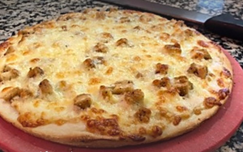 Order Chicken Alfredo Pizza - 10'' (Serves 2) food online from Singas famous pizza store, Kew Gardens on bringmethat.com
