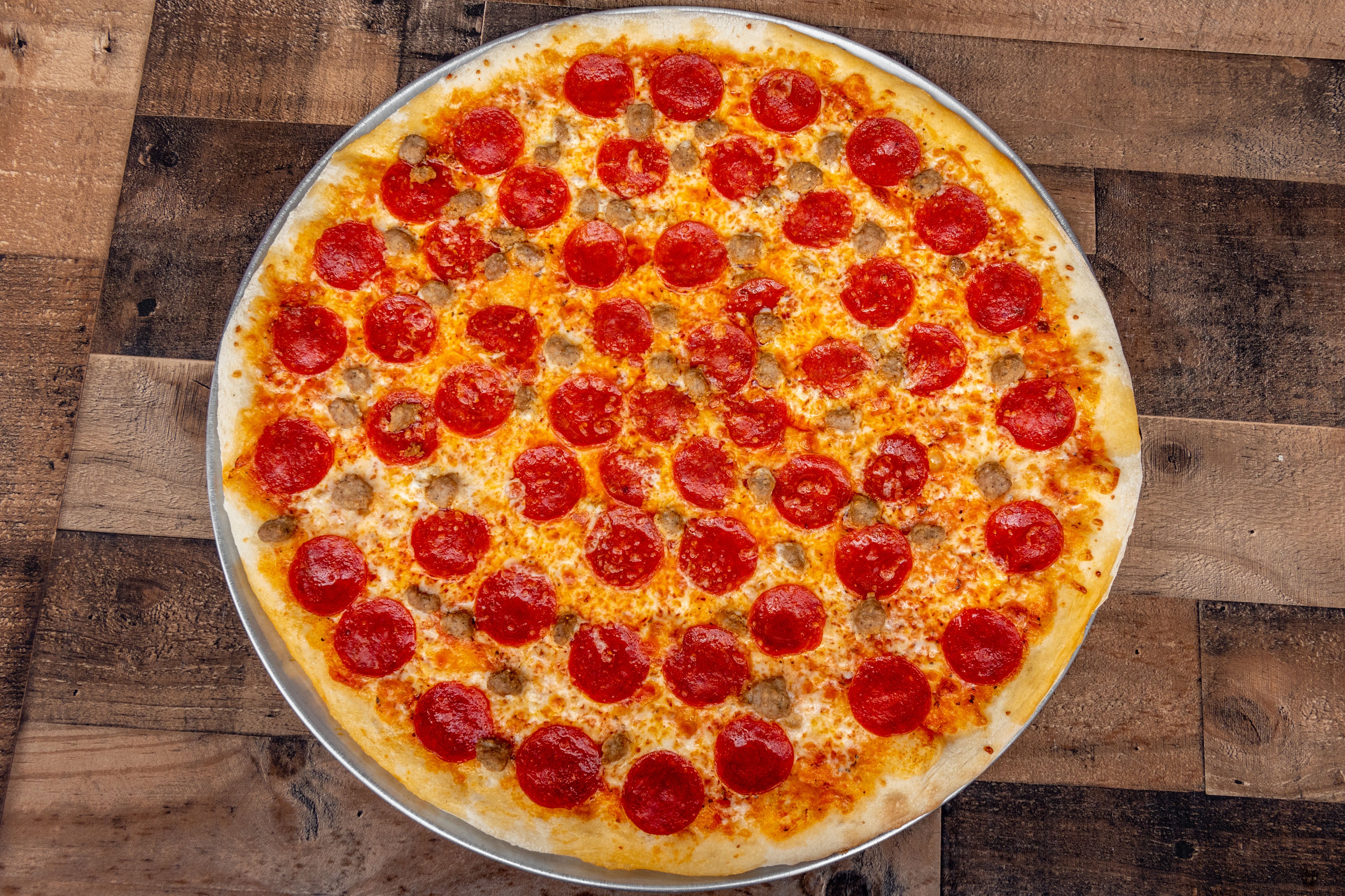 Order Pepperoni & Sausage Slice - Slice food online from San Remo Pizzeria store, San Diego on bringmethat.com