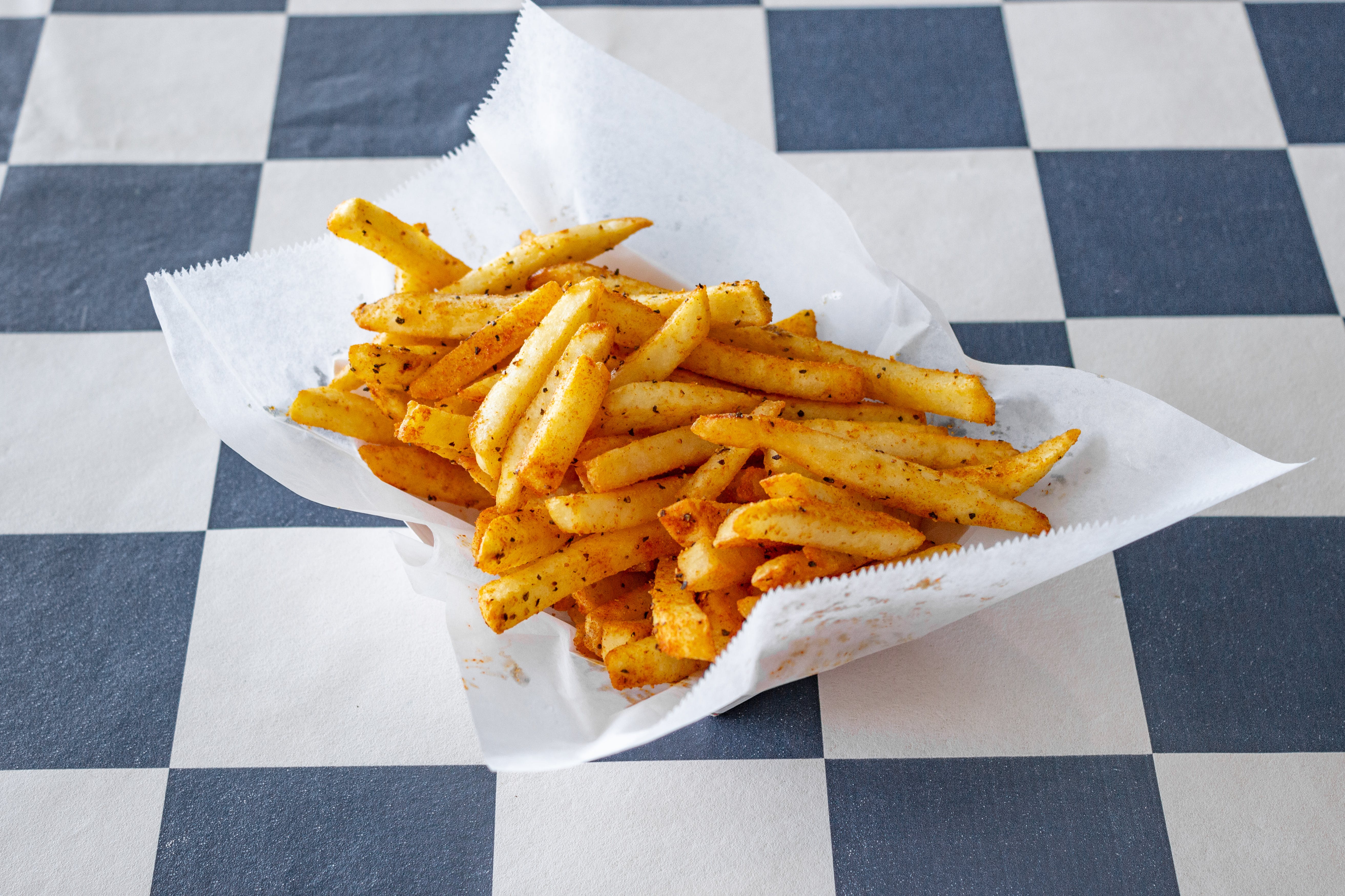 Order Cajun Fries - Side food online from Pizza Works store, Williamsville on bringmethat.com