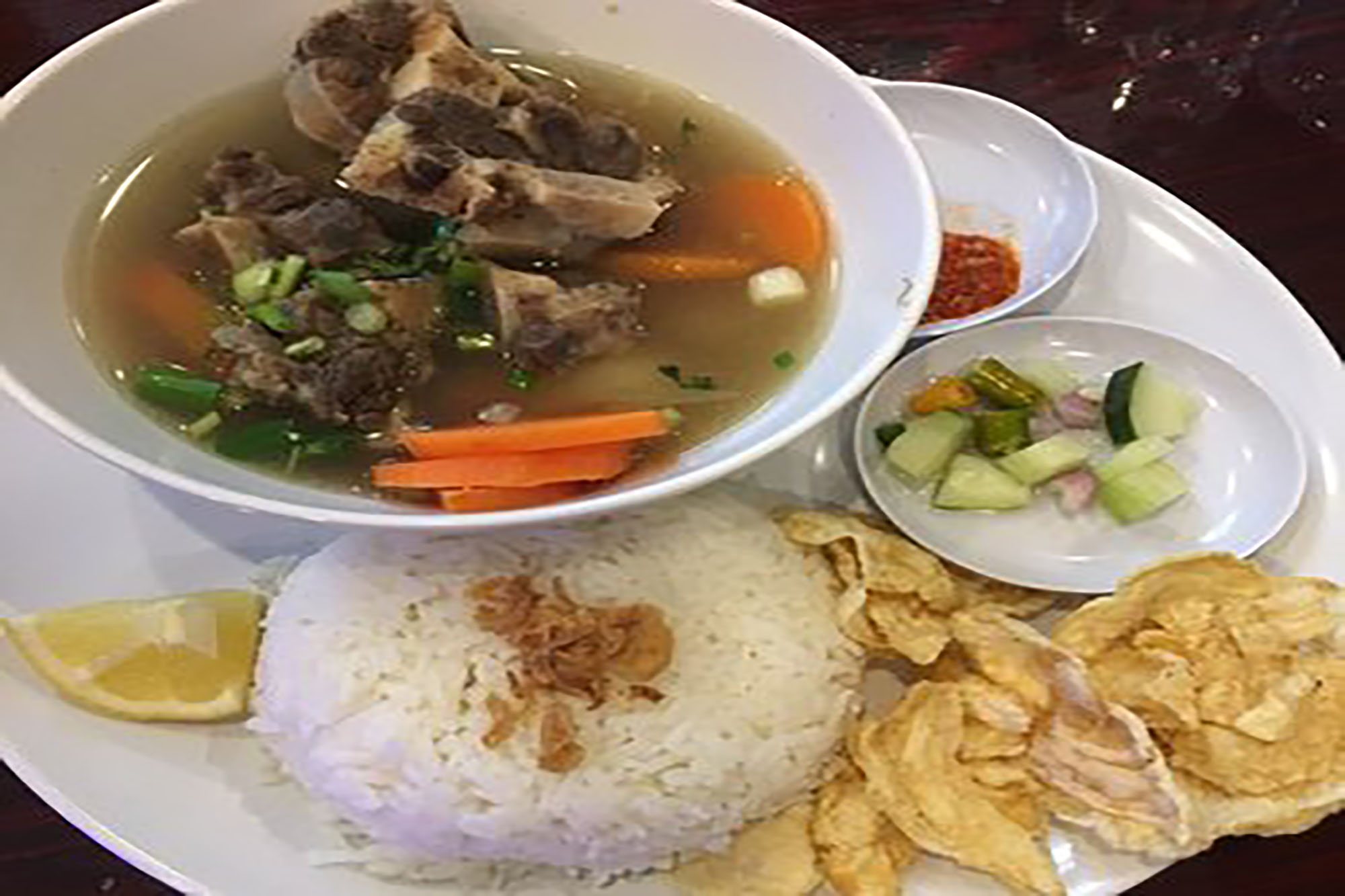 Order Sop Buntut / Ox Tail Soup food online from Awang Kitchen store, Elmhurst on bringmethat.com