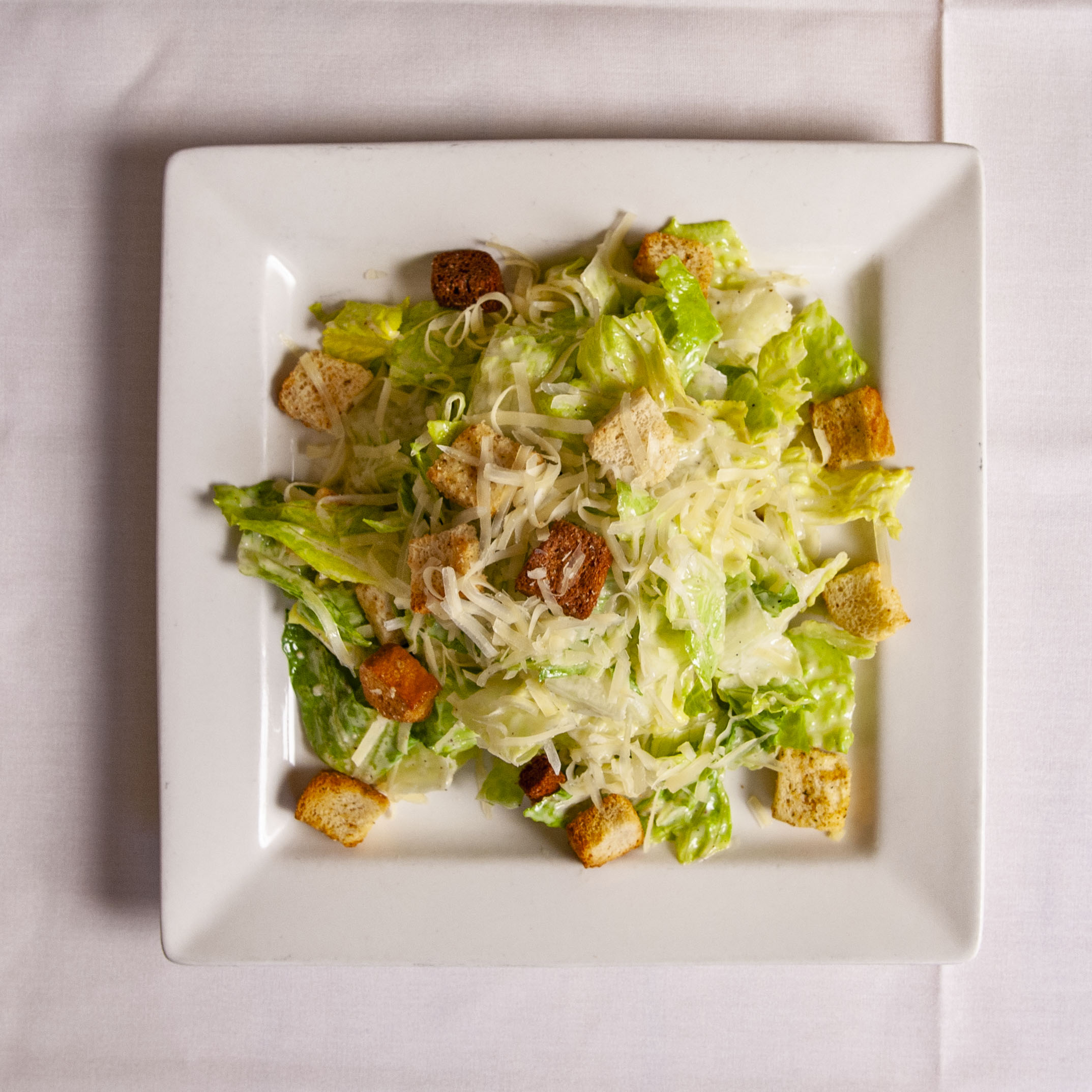 Order Caesar Salad food online from Que Pasta Italian Gourmet Deli store, Saddle Brook on bringmethat.com