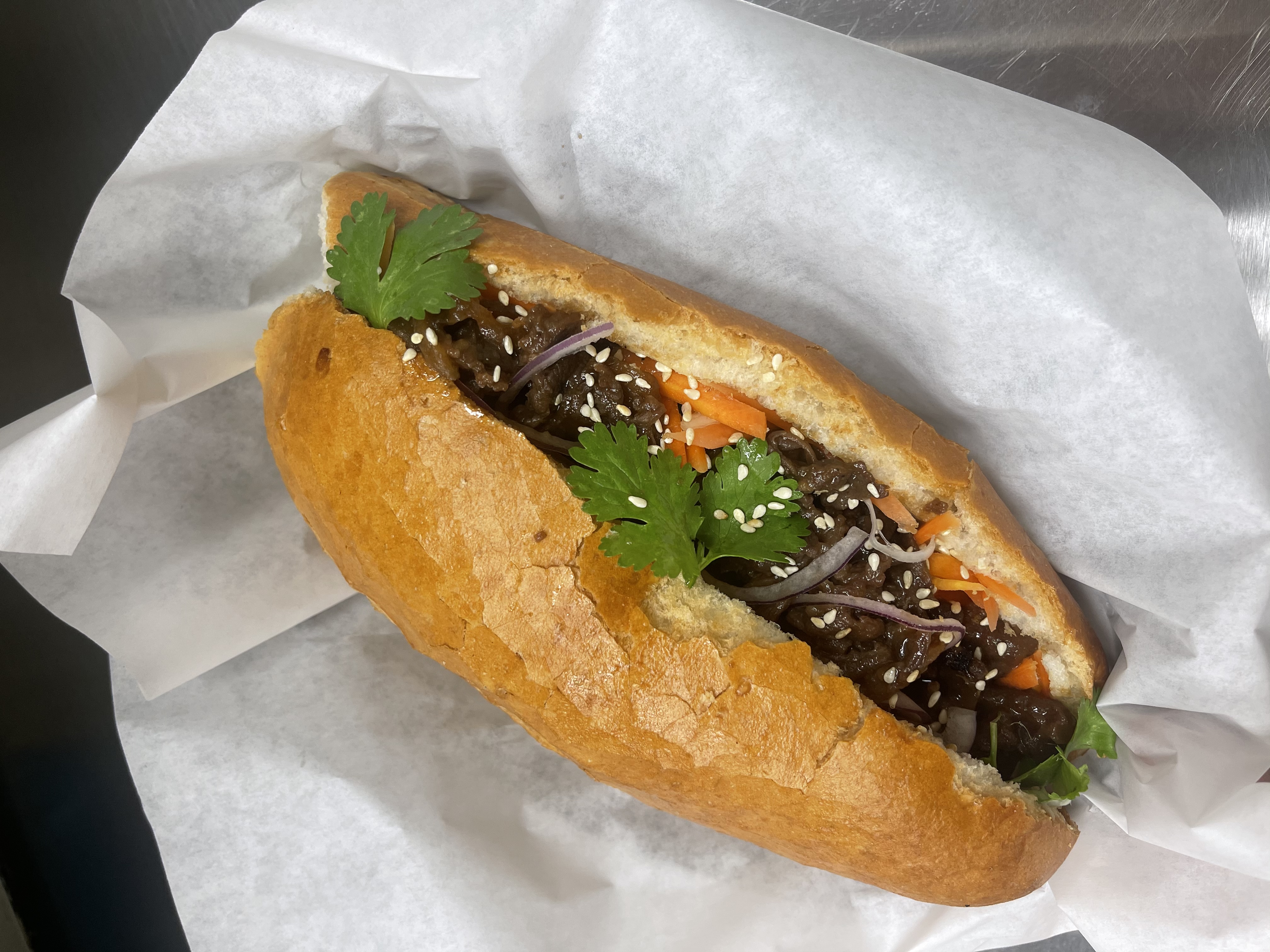 Order Beef bulgogi banh mi (sandwich) food online from Pho Beef Noodle & Grill store, Lewisville on bringmethat.com