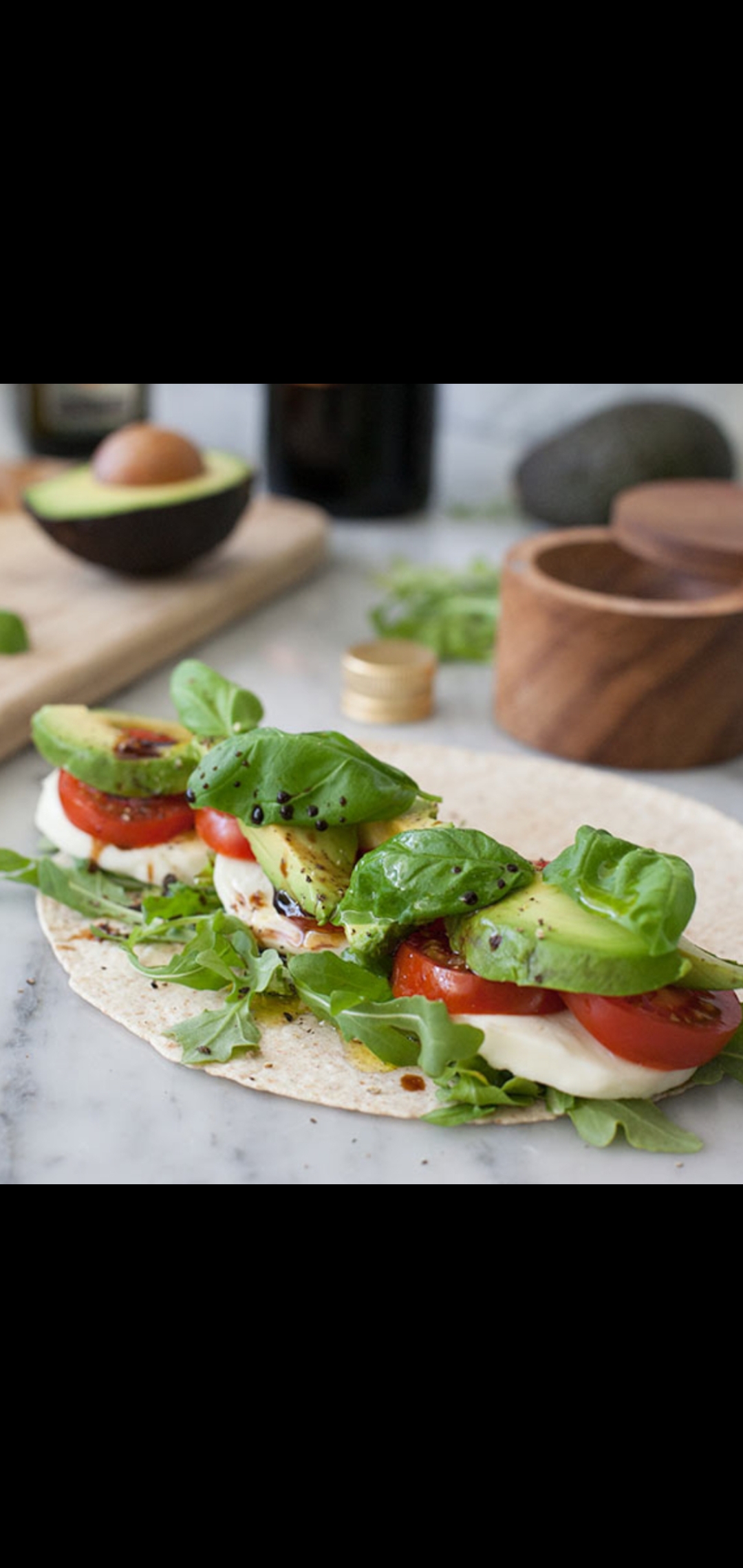 Order  Classic Meatless Wrap (cheese mixed greens tomatoes avocado spinach balsamic vinegar) food online from American Gourmet Foods Deli store, New York on bringmethat.com