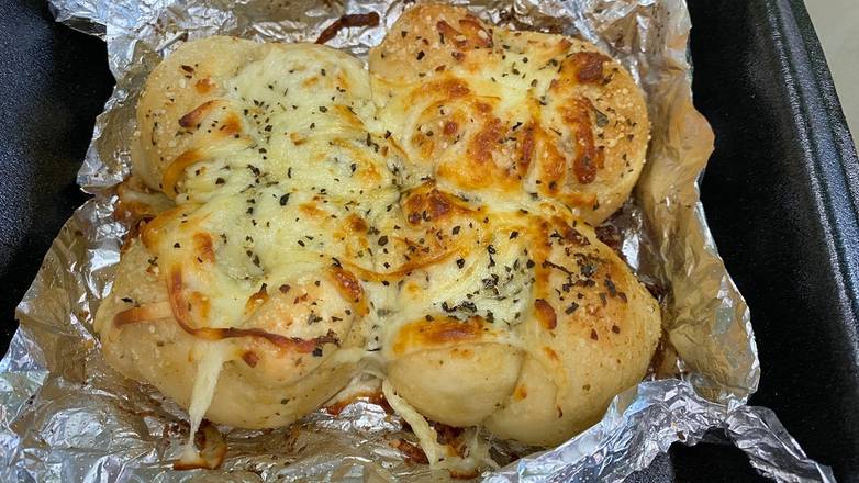 Order Cheesey Garlic Knots (4) food online from Zollo Pizza store, Panama City Beach on bringmethat.com