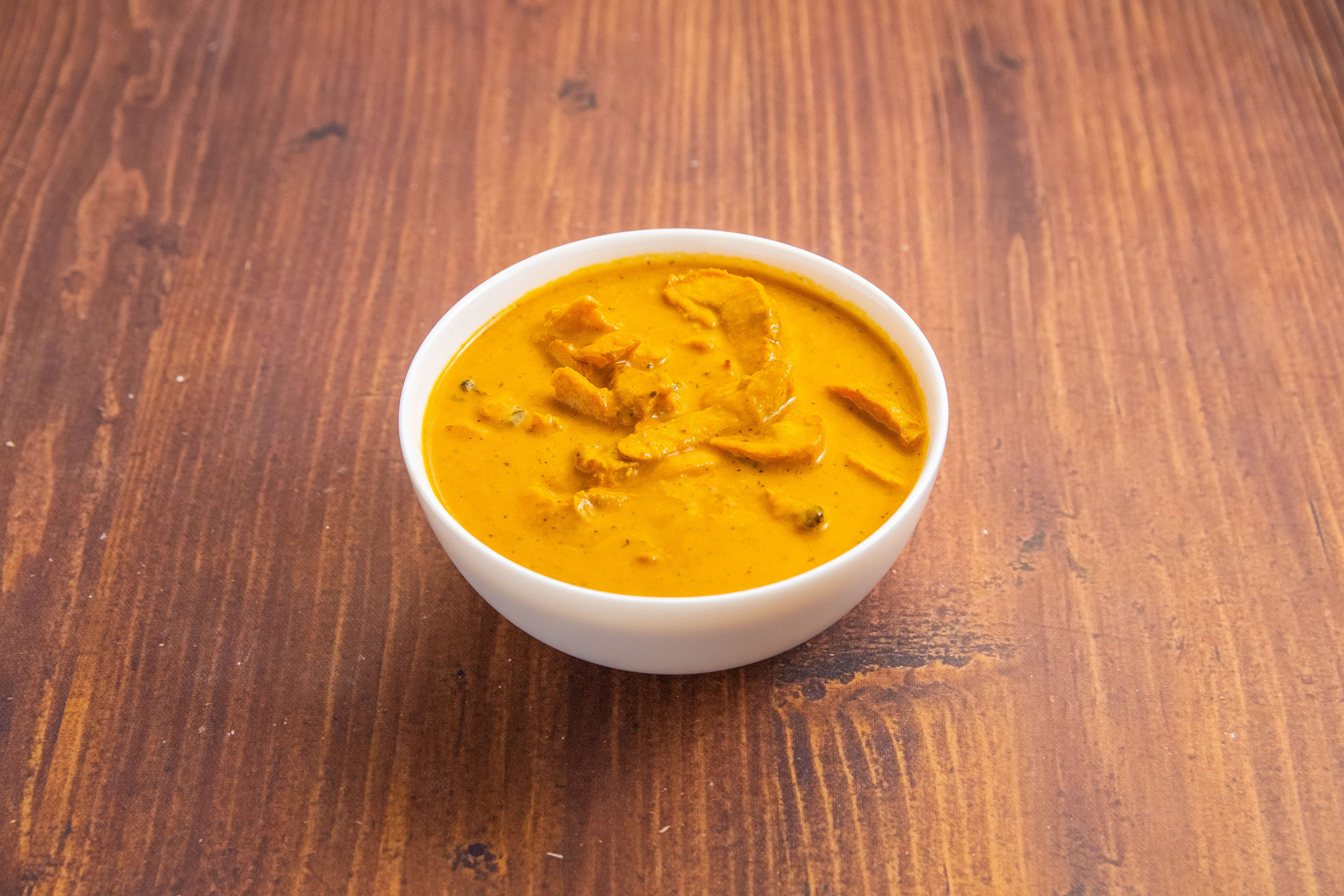 Order 23. Butter Chicken food online from The India Cafe store, Costa Mesa on bringmethat.com