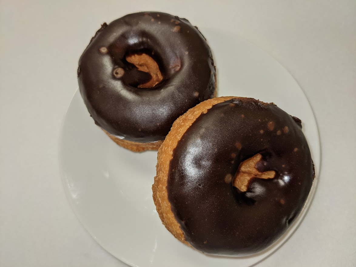 Order Yellow Cake Donut with Chocolate Frosting food online from Morkes Chocolate store, Huntley on bringmethat.com