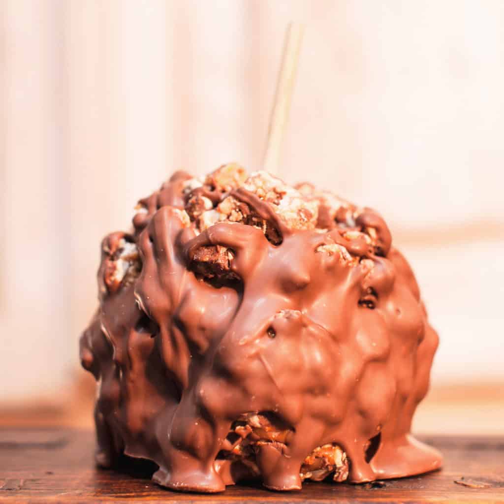 Order Caramel Apple Covered in Snickers® candy and topped with Milk Chocolate food online from Candy Apple Shoppe store, Glenwood on bringmethat.com