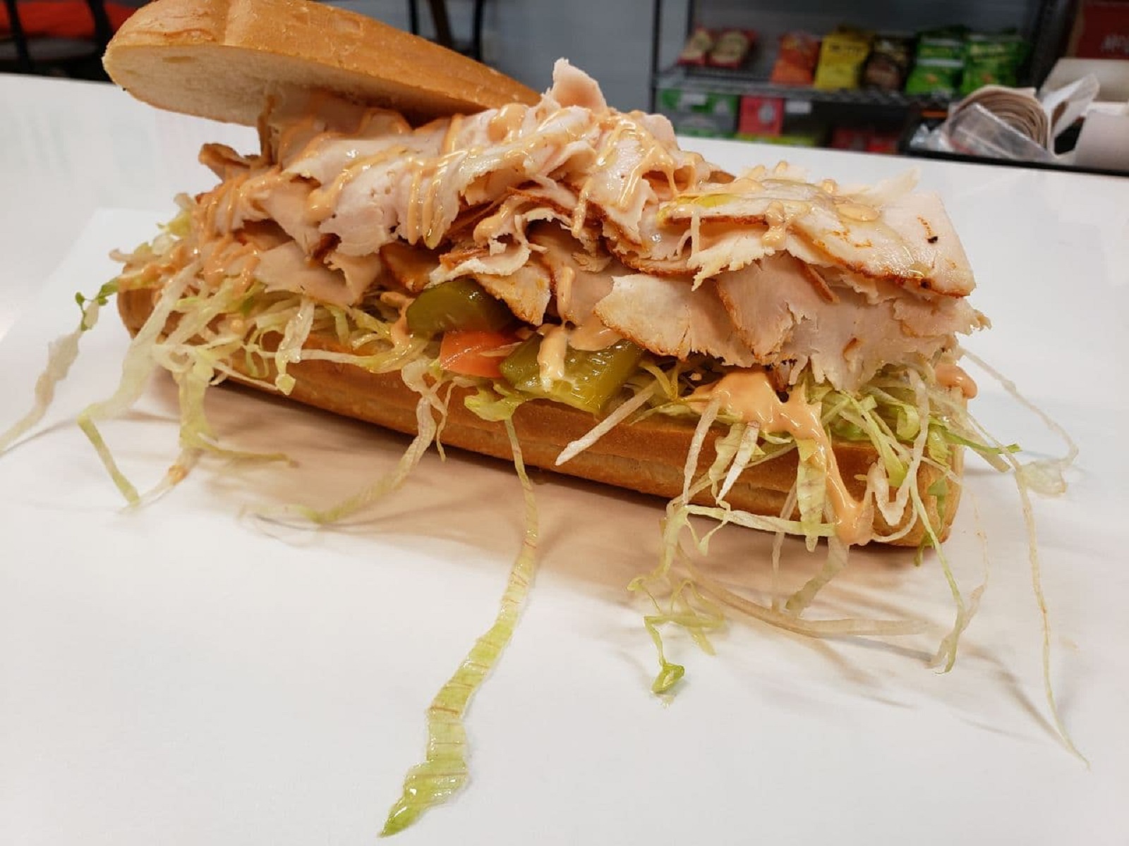 Order SPICY CHICKEN DELI SUB food online from Basil Deli & Cafe store, Canoga Park on bringmethat.com